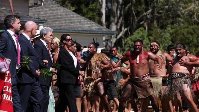 New Zealand government representatives including (L-R) ACT leader David Seymour, Prime Minister Christopher Luxon and New Zealand First leader Winston Peters are welcomed to Waitangi. Picture: Getty Images.