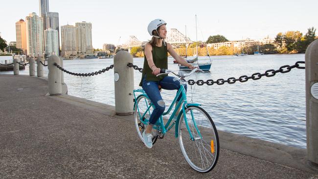 A cyclist on the Brisbane riverfront.