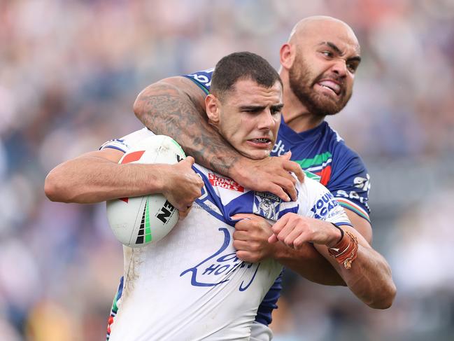 AUCKLAND, NEW ZEALAND - MARCH 26: Jacob Kiraz of the Bulldogs is tackled by Dylan Walker of the Warriors during the round four NRL match between New Zealand Warriors and Canterbury Bulldogs at Mt Smart Stadium on March 26, 2023 in Auckland, New Zealand. (Photo by Phil Walter/Getty Images) *** BESTPIX ***