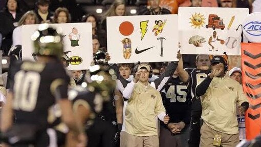 An example of how signs are used in college football to send messages to players.