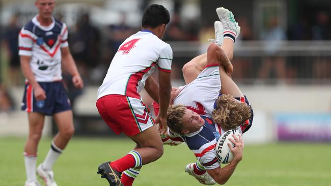 Central Coast Roosters player Jake Herring upended against the Monaro Colts in round one of the Laurie Daley Cup. Picture: Sue Graham