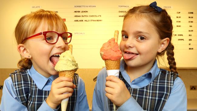 Rebecca Felcher and Harper North, both aged 7, tuck into a gelato at Bottega Gelateria’s new store in Glenelg. Picture: Kelly Barnes.