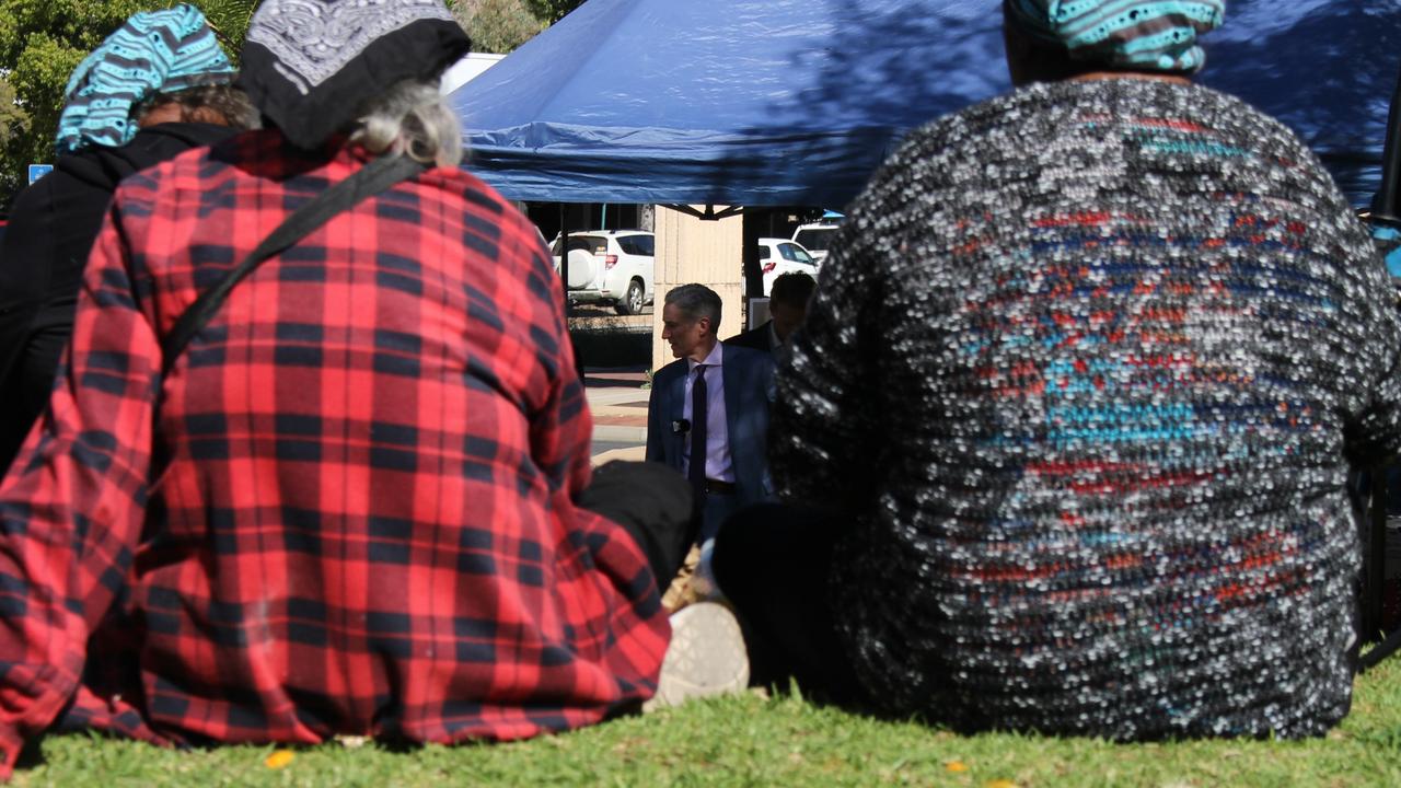 Lawyer Gerard Mullins KC speaks with members of Kumanjayi Walker’s family on the lawns outside the Alice Springs Local Court on Tuesday. Picture: Jason Walls