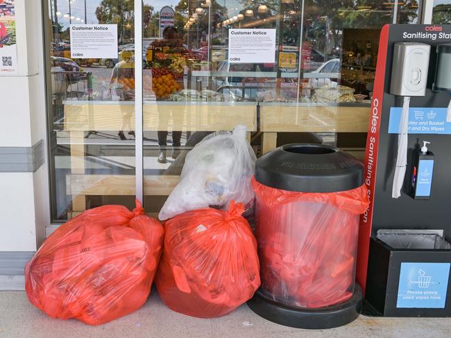 Recycling fail: Plastic bags below a notice in Coles at Park Holme in Adelaide saying soft plastic bags will no longer be recycled. Picture: NCA NewsWire / Brenton Edwards