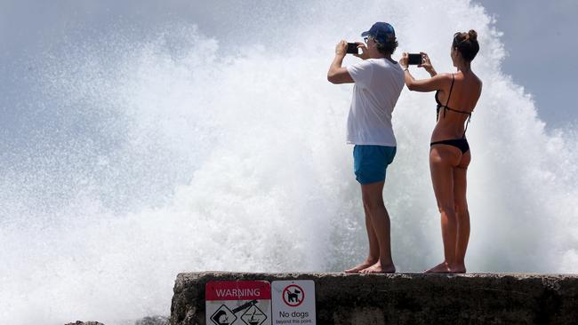 Surfers enjoy large waves at Snapper Rocks .Picture Mike Batterham