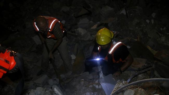 Members of the Palestinian Civil Defense search for people trapped under the rubble of a house destroyed by the Israeli occupation forces on October 7, 2023 in Gaza City, Gaza. Picture: Ahmad Hasaballah/Getty Images)