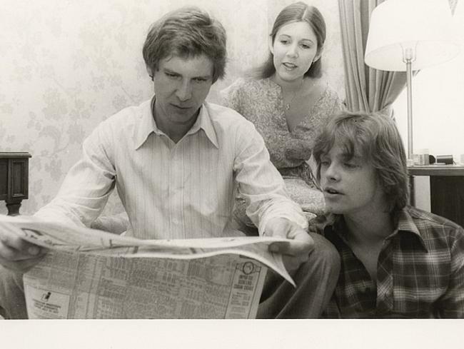 Fisher, Ford and Mark Hamill on the set of a Star Wars film. The movie made them household names. Picture: Carrie Fisher personal collection