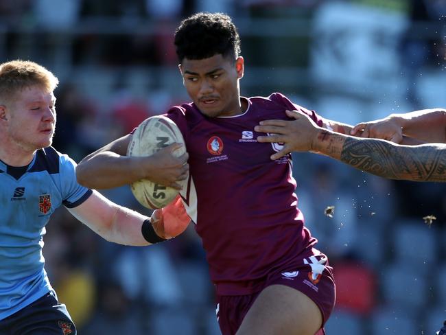 QLD's Karl Oloapu makes a break during the under 18 ASSRL schoolboy rugby league championship grand final between QLD v NSW CHS from Moreton Daily Stadium, Redcliffe.  Picture: Zak Simmonds