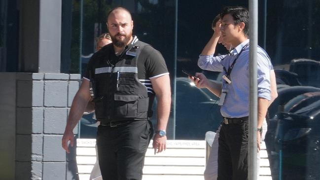 Security officers patrol Westfield West Lakes, where a boy of 11 allegedly injured a female shopper with a sharp projectile on Sunday. Picture: Dean Martin