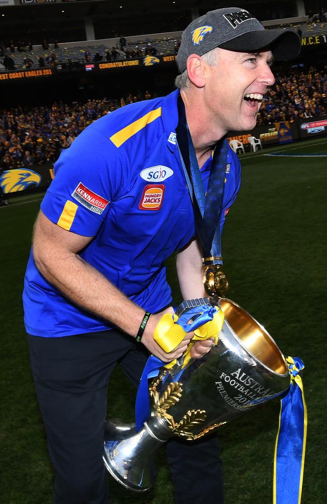 Coach of the Eagles Adam Simpson holds the premiership trophy. Picture: AAP Image/Julian Smith