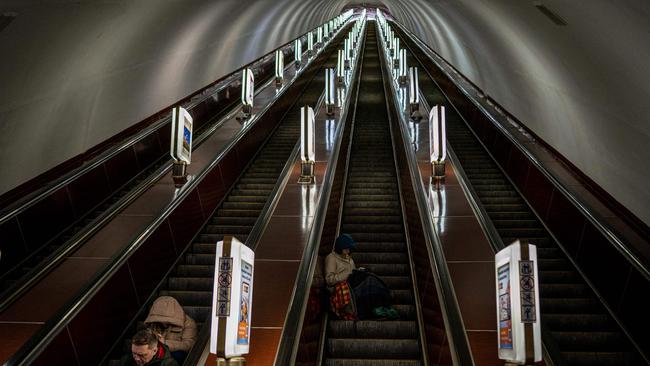 Civilians take shelter at a metro station during a missile attack in Kyiv.