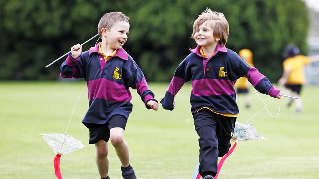 Kindergarten students from The Hutchins School, Henry Woods, 5 and Vincent Pacza, 5 fly their kites as part of the school's group kite flight. Picture: Zak Simmonds