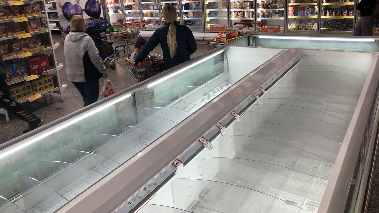 Shoppers at Coburg Coles, Melbourne, emptied shelves and freezers. Picture: David Crosling