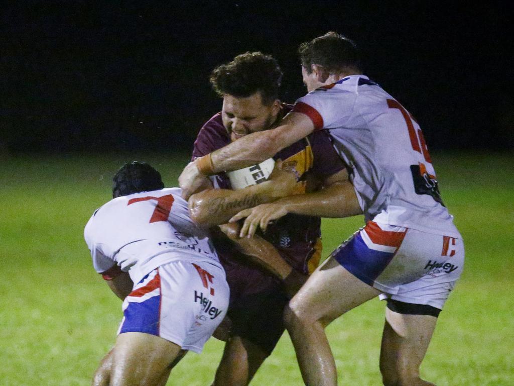 Cockatoo's Tyler Ratcliffe is crunched in an Ivanhoes tackle in the Cairns and District Rugby League (CDRL) match between the Ivanhoe Knights and the Southern Suburbs Cockatoos, held at Smithfield. Picture: Brendan Radke