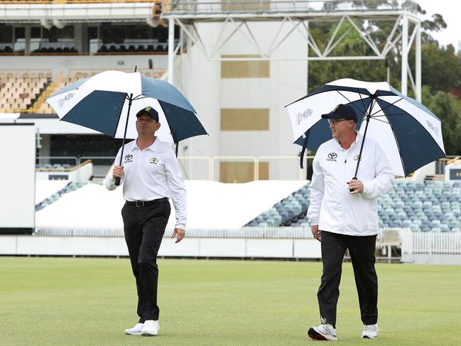 PERTH, AUSTRALIA - OCTOBER 19: Umpires Sam Nogajski and Mike Graham-Smith walk from the field after talks with ground staff as rain delays play during day three of the Sheffield Shield match between Western Australia and Tasmania at the WACA, on October 19, 2021, in Perth, Australia. (Photo by Paul Kane/Getty Images)