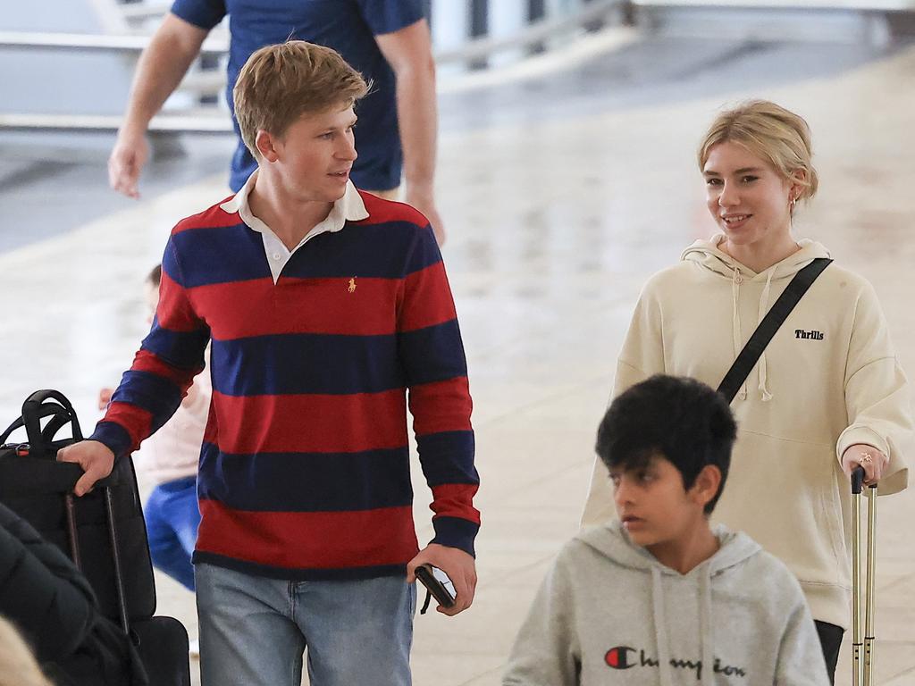 The couple shared a tender moment as they walked through the terminal. Pictures: Media-Mode.com