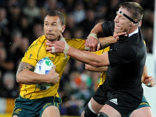 Wallabies Quade Cooper (L) is tackled All Blacks Brad Thorn during New Zealand v Australia 2011 Rugby World Cup (RWC) semi-final match at Eden Park Stadium in Auckland, 16/10/2011.