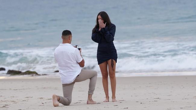 Rabbitohs star Braidon Burns, proposes to his partner Tiannan Pennini at Coolangatta Beach. Picture: Sunny Brar