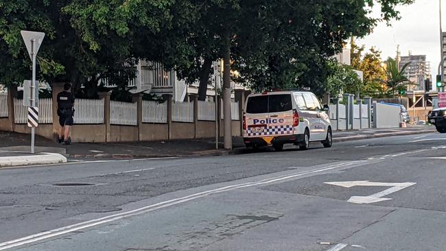 Police close a street at Bowen Hills. Picture: David Clark