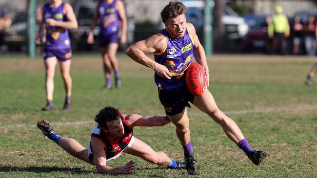 EFL: Vermont’s Tyson Calder slips away from the tackler. Picture: George Salpigtidis