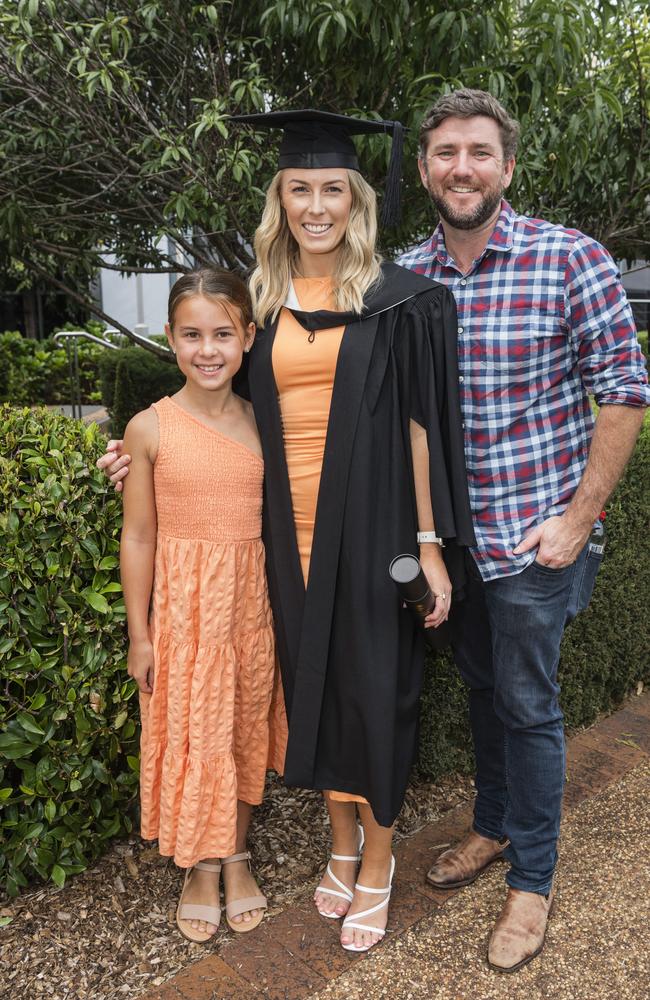 Bachelor of Business graduate Kari Smith with daughter Ahmaia Haitana and partner Aaron Cluff at a UniSQ graduation ceremony at Empire Theatres, Wednesday, February 14, 2024. Picture: Kevin Farmer