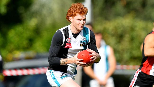 Mitchell Hearne of Hillside runs with the ball during the round two EDFL Strathmore Community Bank Division One Seniors match between West Coburg and Hillside at Shore Reserve, on April 20, 2024, in Melbourne, Australia. (Photo by Josh Chadwick)