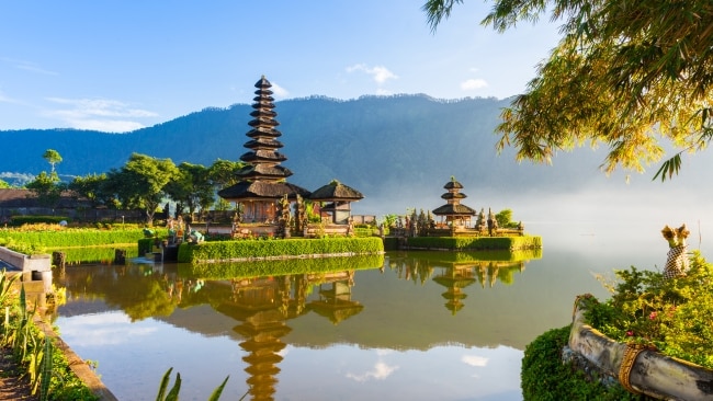 If you wouldn't do it at a church, don't do it at a Balinese temple.