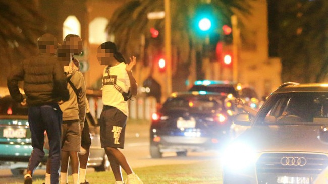 Youths in St Kilda on Saturday night. Picture: Mark Stewart