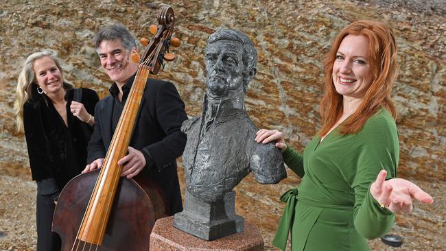 Adelaide Baroque violist Heidi von Bernewitz and violone player Rob Nairn with the bust of explorer Matthew Flinders and soprano Bethany Hill at Flinders University. Picture: Tom Huntley