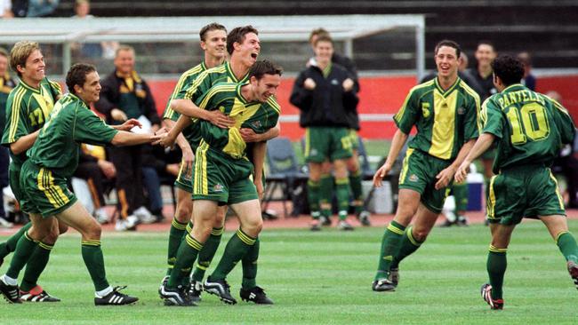 Australia player Aaron Golding after scoring goal is hugged by team-mates. Soccer - Australia Joeys vs USA FIFA U17 World Championship semi-final match at QU2 Stadium Christchurch New Zealand 24 Nov 1999. /Soccer/International/matches