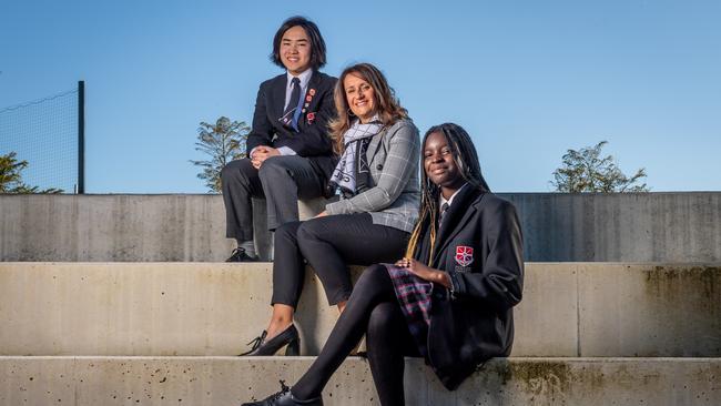 Caroline Chisolm Catholic College school careers adviser Julie Pilioglou, with Year 10 students Sokoyou and Allan, says it’s important for students to choose subjects they will enjoy. Picture: Jake Nowakowski