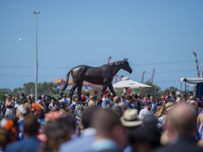 The statue of three-time Melbourne Cup winner Makybe Diva is a popular place on the Flemington lawn. Picture: Jason Edwards