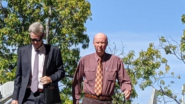 John Starmer (right) walks from Townsville Courthouse after an earlier appearance.