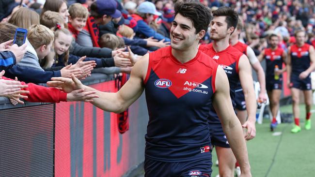 Christian Petracca high fives the fans after beating Brisbane last year. Picture: Michael Klein