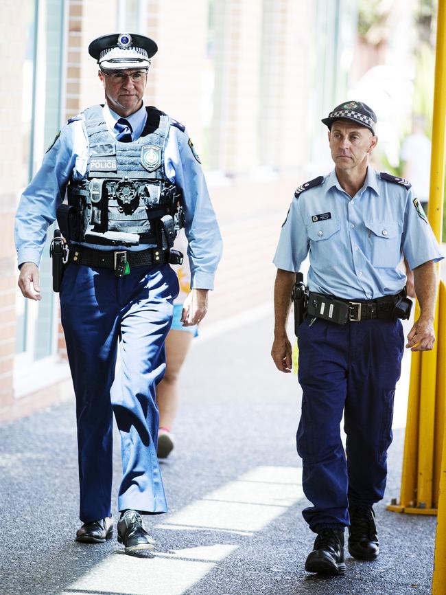 Superintendent David Driver and Highway Patrol Supervisor Tidyman arrive at Liverpool Hospital to visit the two injured police officers.