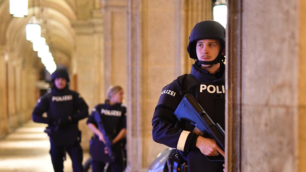 Armed police patrol at a passage near the opera in central Vienna. Picture: JOE KLAMAR / AFP.