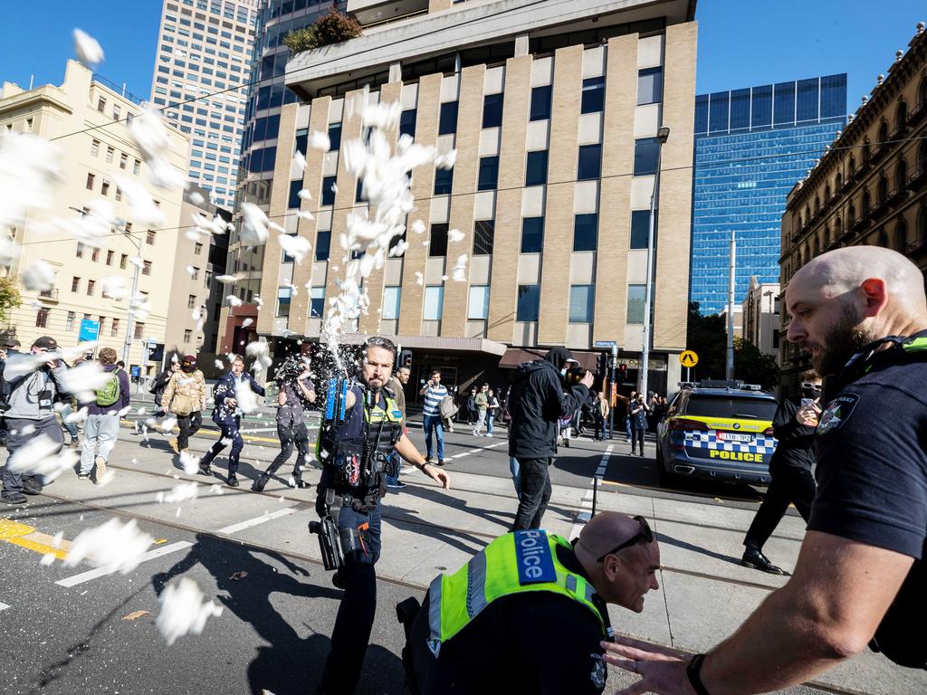 Police use pepper spray after neo-Nazis from the National Socialist Network clashed with counter-protesters from the Campaign Against Racism and Fascism at a Stop Immigration Rally in Melbourne. Picture: Jake Nowakowski