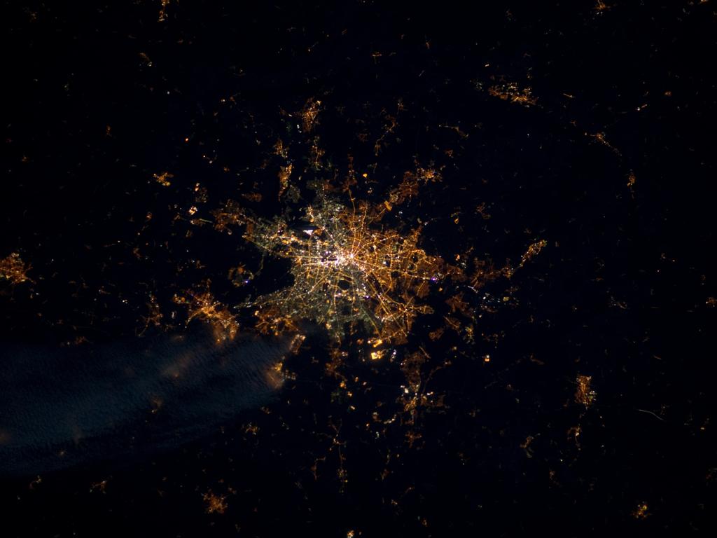 This picture by European Space Agency astronaut André Kuipers starkly shows the divided between East and West Berlin due to different street lights in the city. The yellowish lights show East Berlin and the greenish tones show West Berlin. It was taken in 2012 using a NightPod camera that tracks the earth as it moves below the International Space Station.