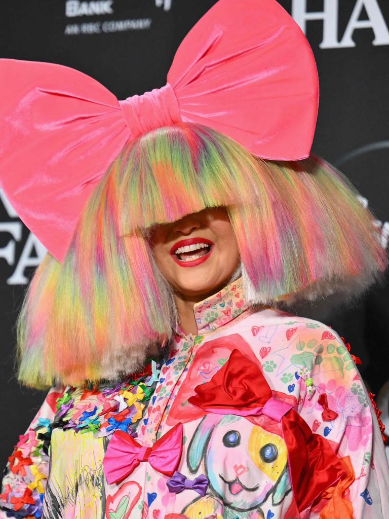 Sia, seen here in November last year, usually hides her face at big public events. Picture: ANGELA WEISS / AFP