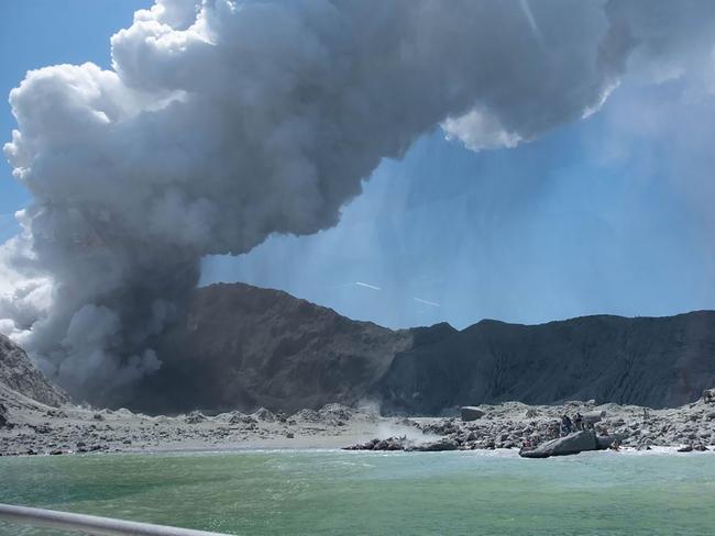 New Zealand's White Island spewing steam and ash minutes following the deadly eruption. Picture: AFP