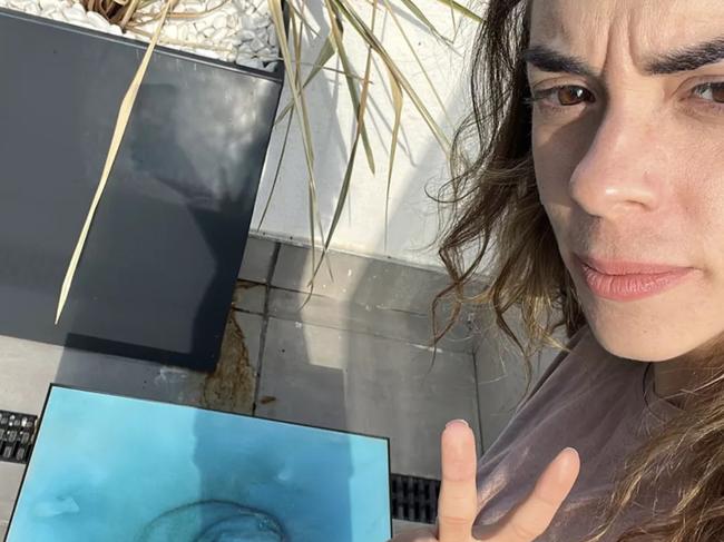 Brazilian DJ Ana Julieta Garcia poses with a coffee table with an unusual image on it, in undated photo. Garcia who lives in Spain, paid about USD 1,890 for the coffee table . (Ana Julieta Garcia/CEN)  Picture: CEN/australscope