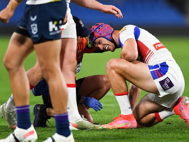 Newcastle Knights fullback Kalyn Ponga is injured against the Melbourne Storm on July 17, 2021.