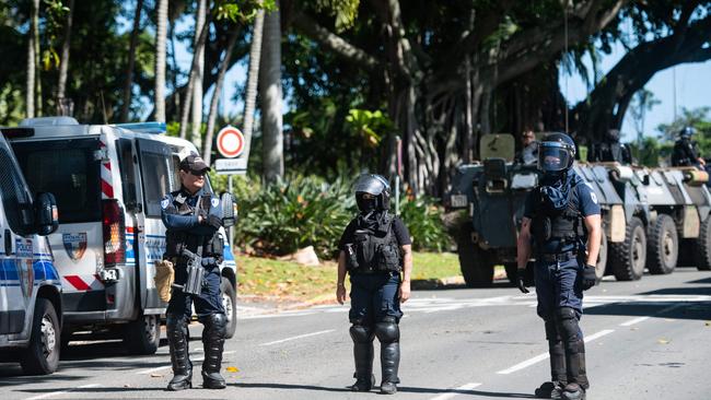 Police in riot gear are seen outside a police station in Noumea. Picture: Delphine Mayeur/AFP