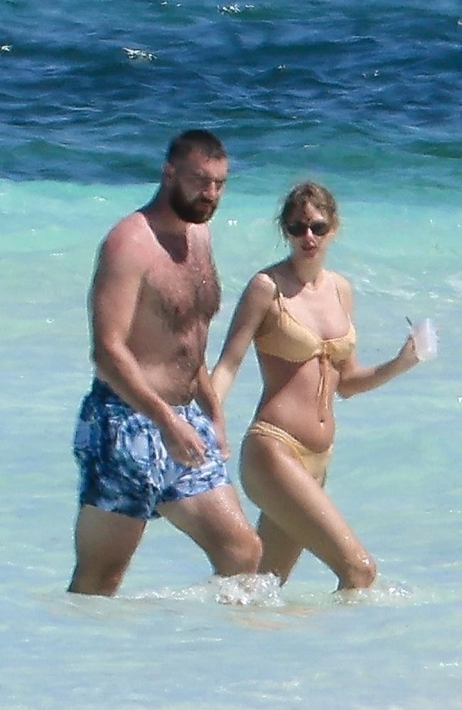 Taylor Swift and Travis Kelce on their first romantic beach getaway together. Picture: Backgrid Australia