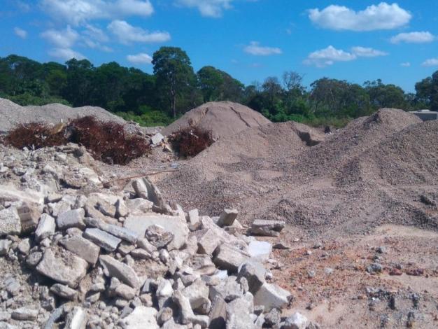 Photo of the existing landscaping and building material storage area.