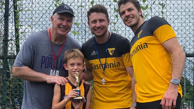 Frawley poses for a photo with a young footy fan. Picture: Jeff Kennett