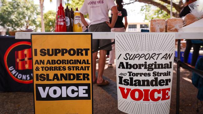 (FILES) Supporters of the "YES" campaign in the upcoming "Voice" referendum set up a barbecue that is part of their booth in the centre of the Northern Territory capital city of Darwin on August 30, 2023. (Photo by DAVID GRAY / AFP)