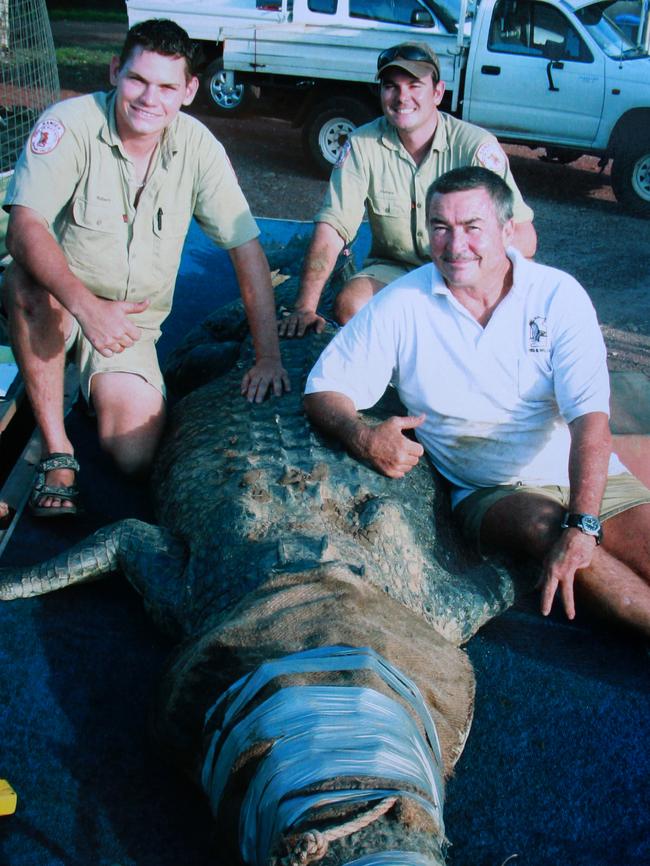 Robbie Risk, Andrew Woods and Tommy Nichols with a large 4.8m saltwater crocodile caught in trap in Adelaide River in 2008. Picture: Supplied