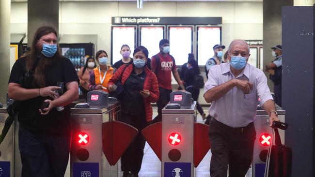 Commuters clear the gates at Parramatta train station this morning. Picture: John Grainger