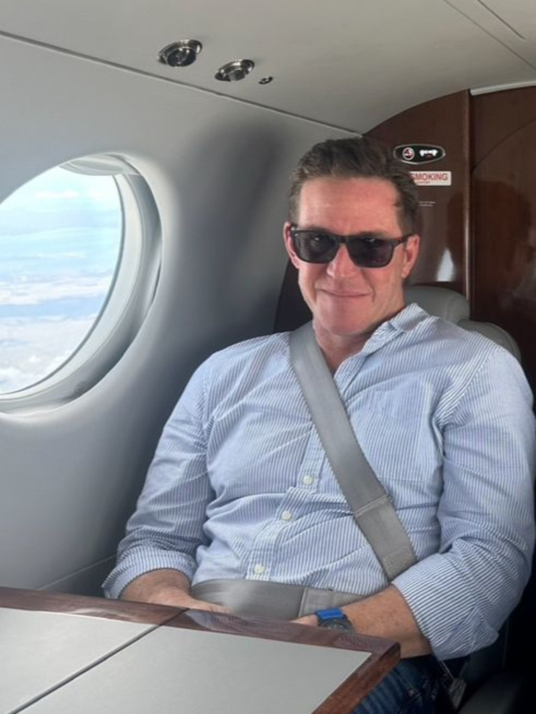 Sam Mitchell flying between appointments.